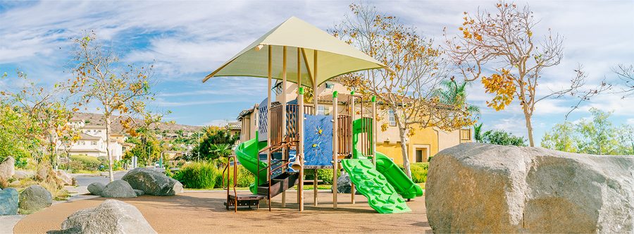 HOA community playground with shade structure